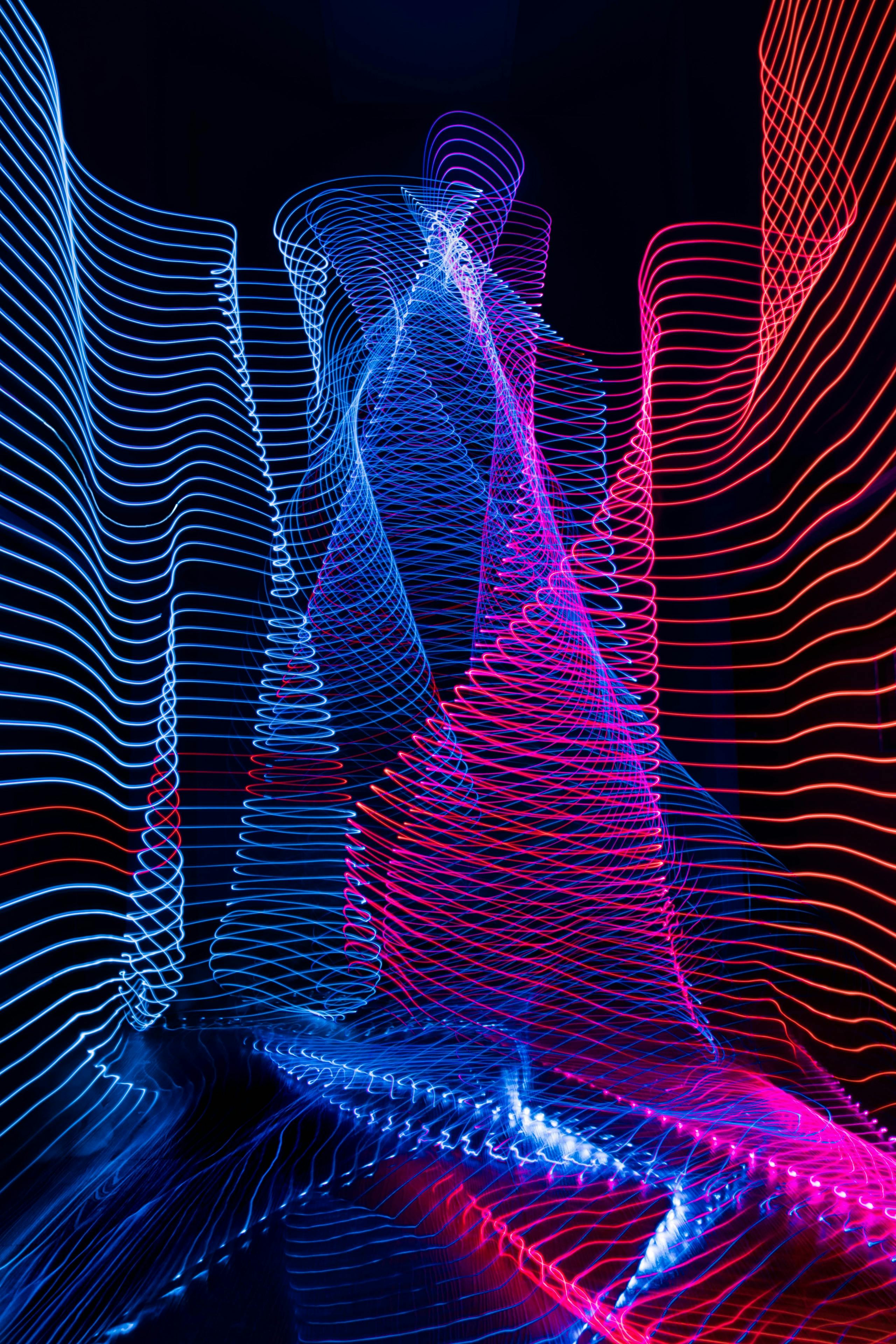 Wavy lines of light in blue, purple, and red